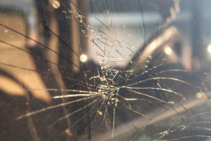 Cracked windshield after a car accident.