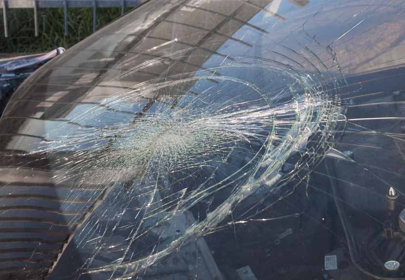 damaged car, with broken windshield